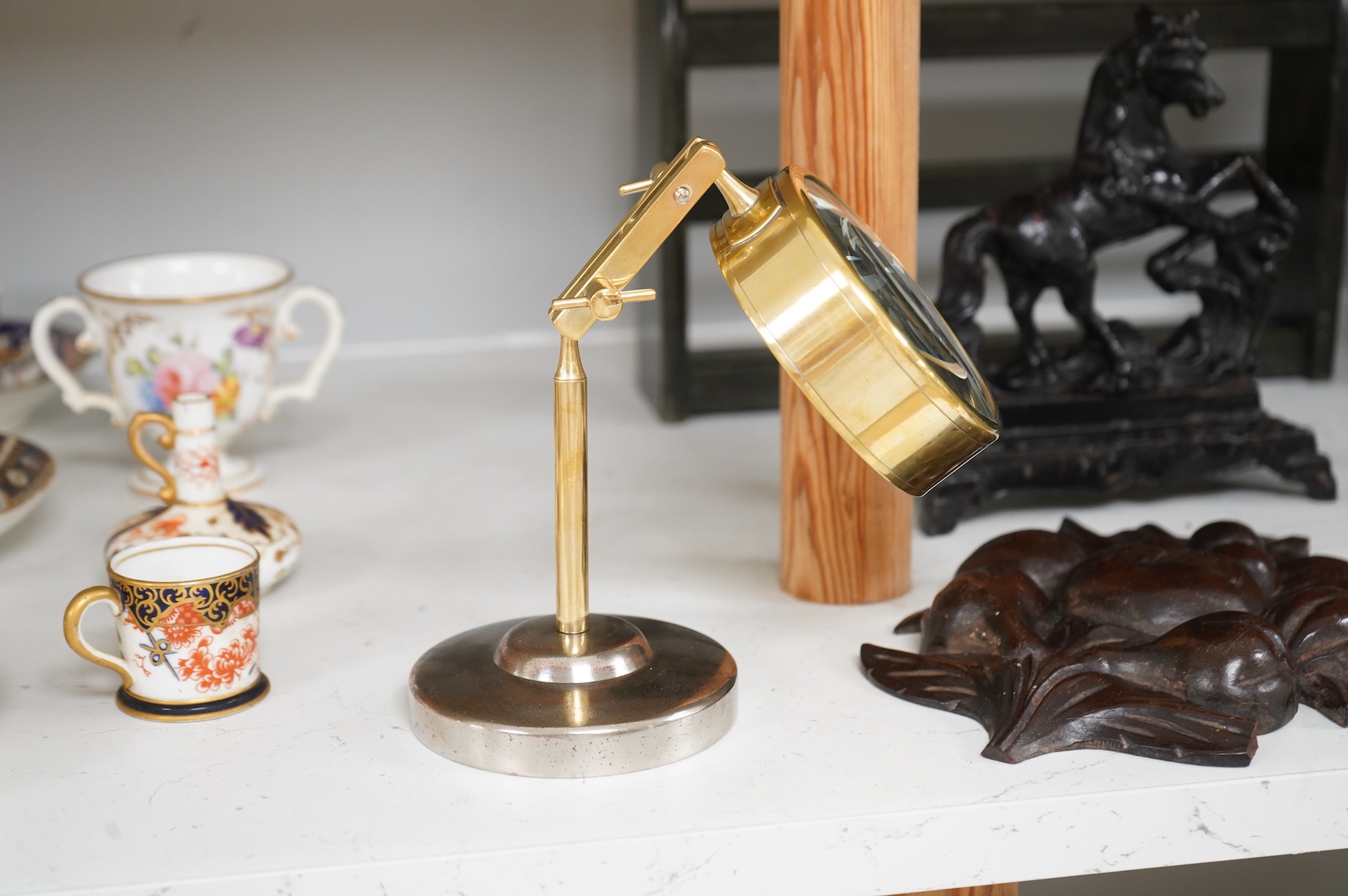 Sundry items to include an iron money box, brass letter rack, horse door stop and a 19th century oak carving, largest 32cm high